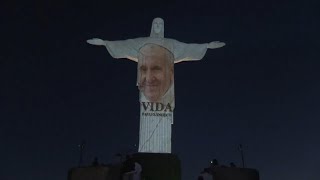 In Brazil the iconic Christ the Redeemer statue lights up to honour the Pope's new book