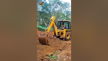 Preparing land for farming using a JCB. Backhoemaster.
