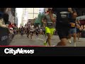 Thousands of runners take part in the TCS Toronto Waterfront Marathon