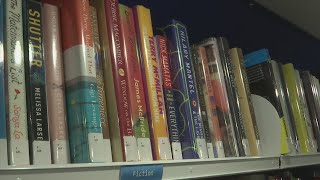 Friends of the Bay County Public Library give out free library cards