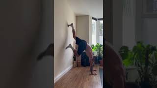 Wall facing handstand L-shape hold