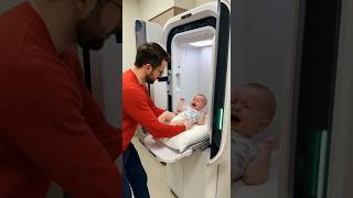 AI Machine Changing Baby Diapers in Public