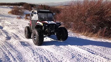 Snow wheeling across icy snow drifts, polaris rzr with 35 inch tires