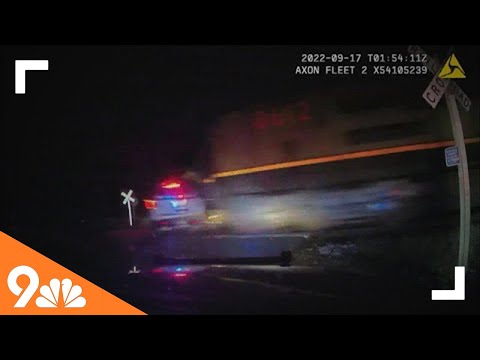 Video shows train hitting police cruiser with suspect inside