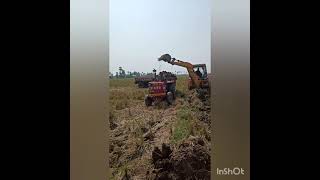 Jcb 3Dx Loading Mud To A Madhidra 475 Dl Tractor