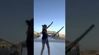 Rifle flourish behind the back trick
