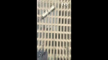 Baltimore building explosion injures 10, traps workers