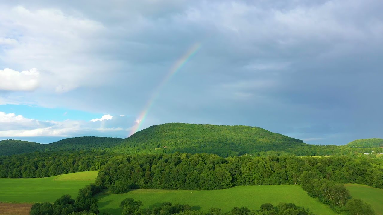 Rainbow Consumed by clouds- Drone video