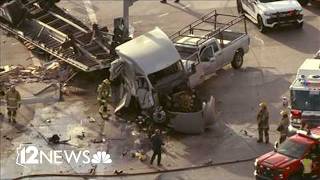 VIDEO: Crash sends semi-truck off side of I-10 overpass