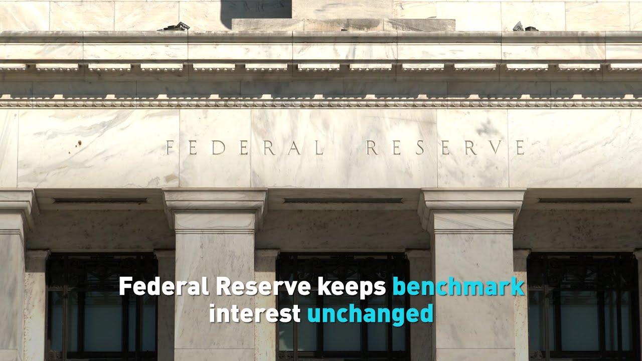 Federal Reserve keeps benchmark interest unchanged - YouTube