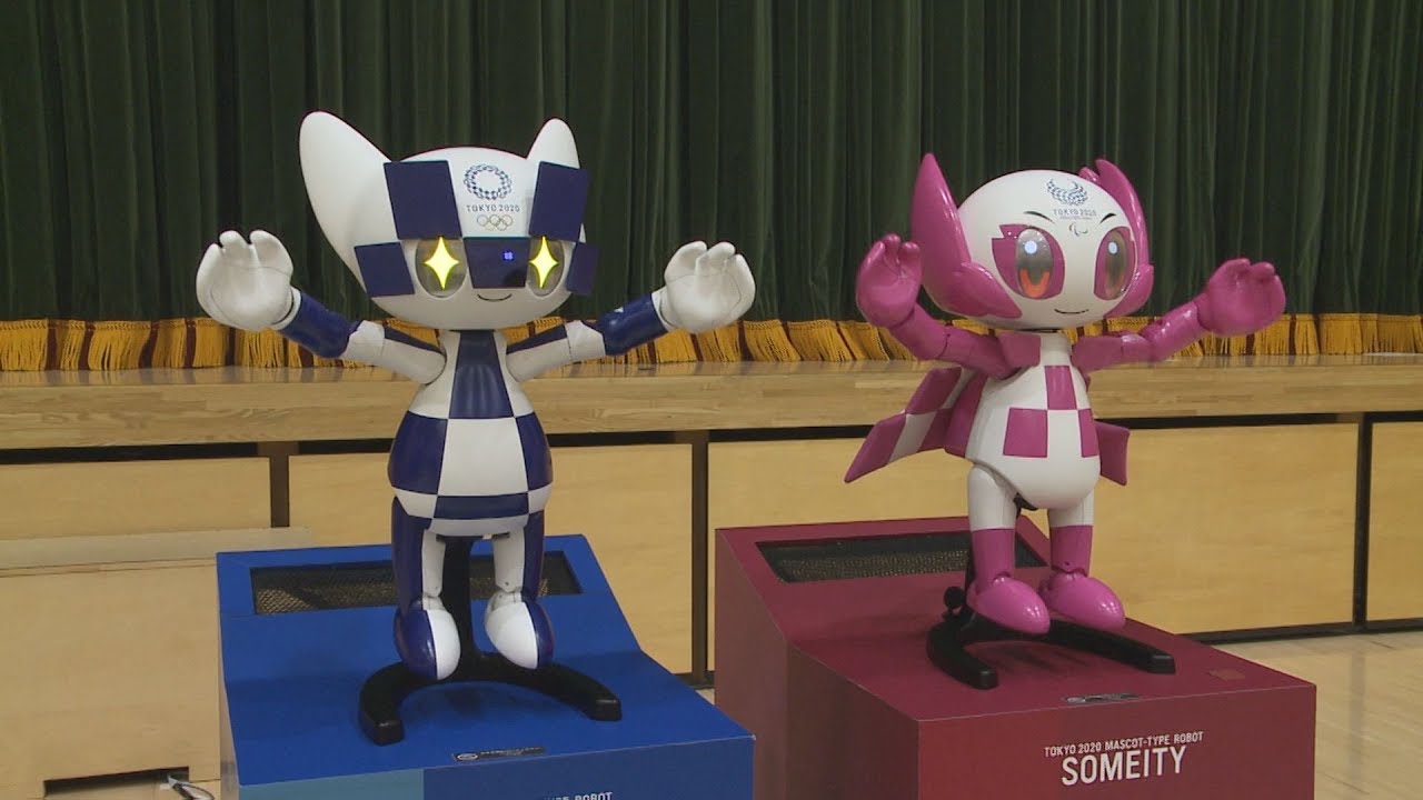 Olympic mascot robot demonstrates functions, showing remote