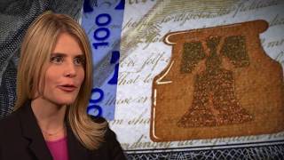 How can I determine if the redesigned $100 note is genuine?