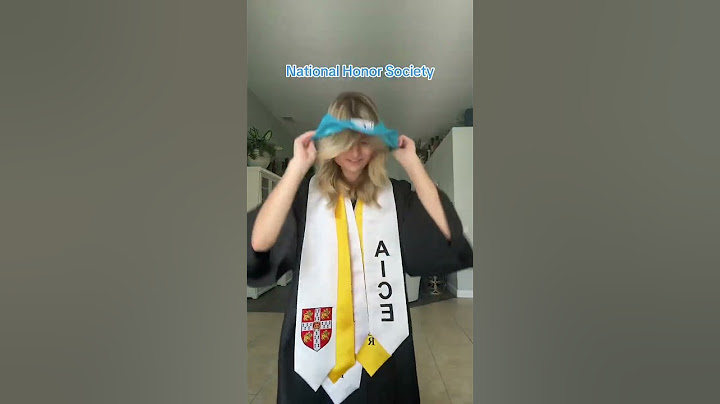 Girl is showing each core, stole, and medals that she received as graduation honors!