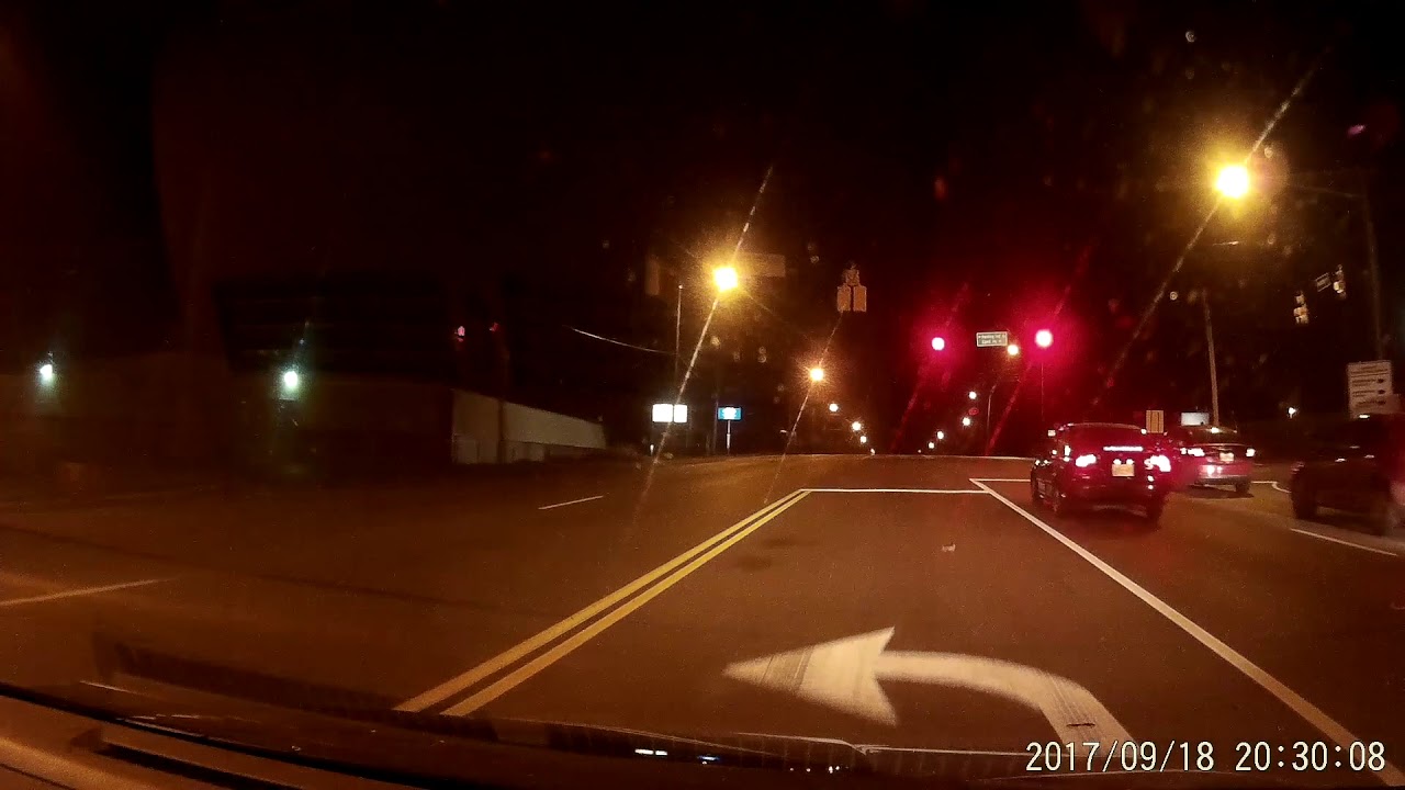 DASH CAM Two cars run red light in front of police station - YouTube