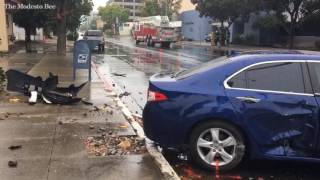 Car crashes into Modesto Bee building, two injured
