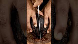 Cutting A Black Coconut