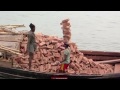 This guy can carry alot of bricks on his head