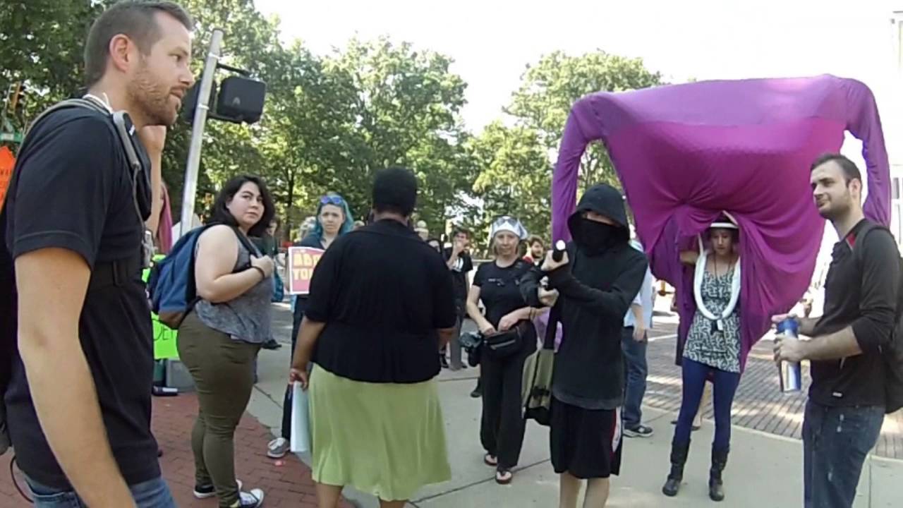 Masked Thug Attacks Pro-Life Display with Club, Threatens Activist