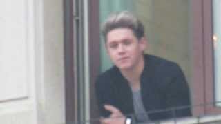 Liam, Zayn and Niall waving at fans at the window of their hotel in Milan, December 12th 2013