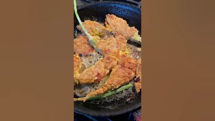 Cheese stuffed squash blossoms in the fryer!