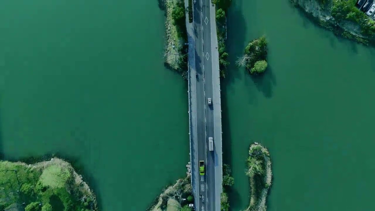 Aerial View of Bridge Over Scenic River