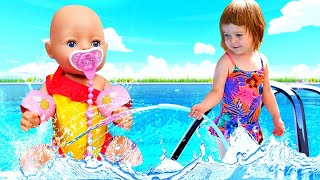 Kids play with dolls & Feeding baby dolls at the swimming pool - Baby Born doll & Family fun video.