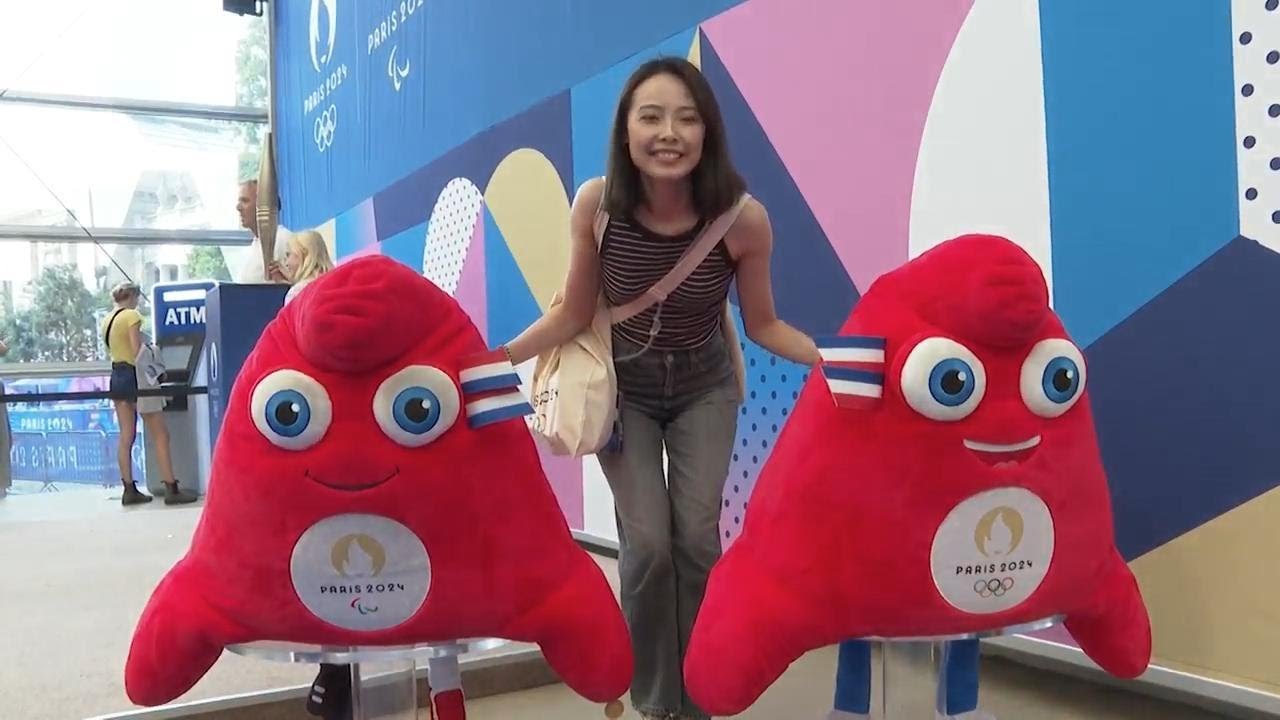 Demand for olympic mascot souvenirs as throngs of tourists queue up at