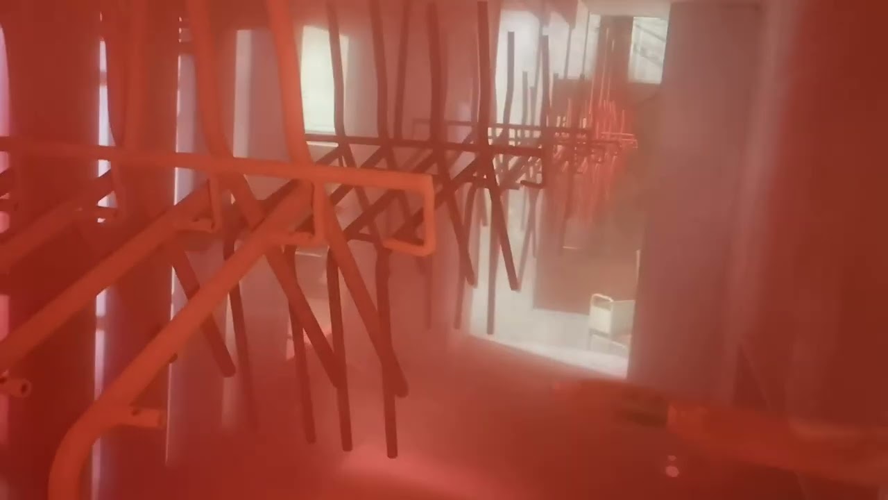 Four steel pipe parts are suspended side by side to improve powder coating efficiency.