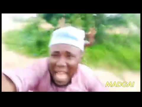 african guy running away from tribe member but with sponge bob music