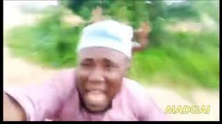 african guy running away from tribe member but with sponge bob music