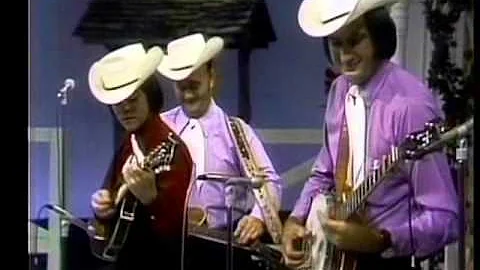 Lester Flatt and The Nashville Grass with a young ...