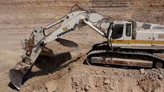 Liebherr 974C loading 769D and A30
