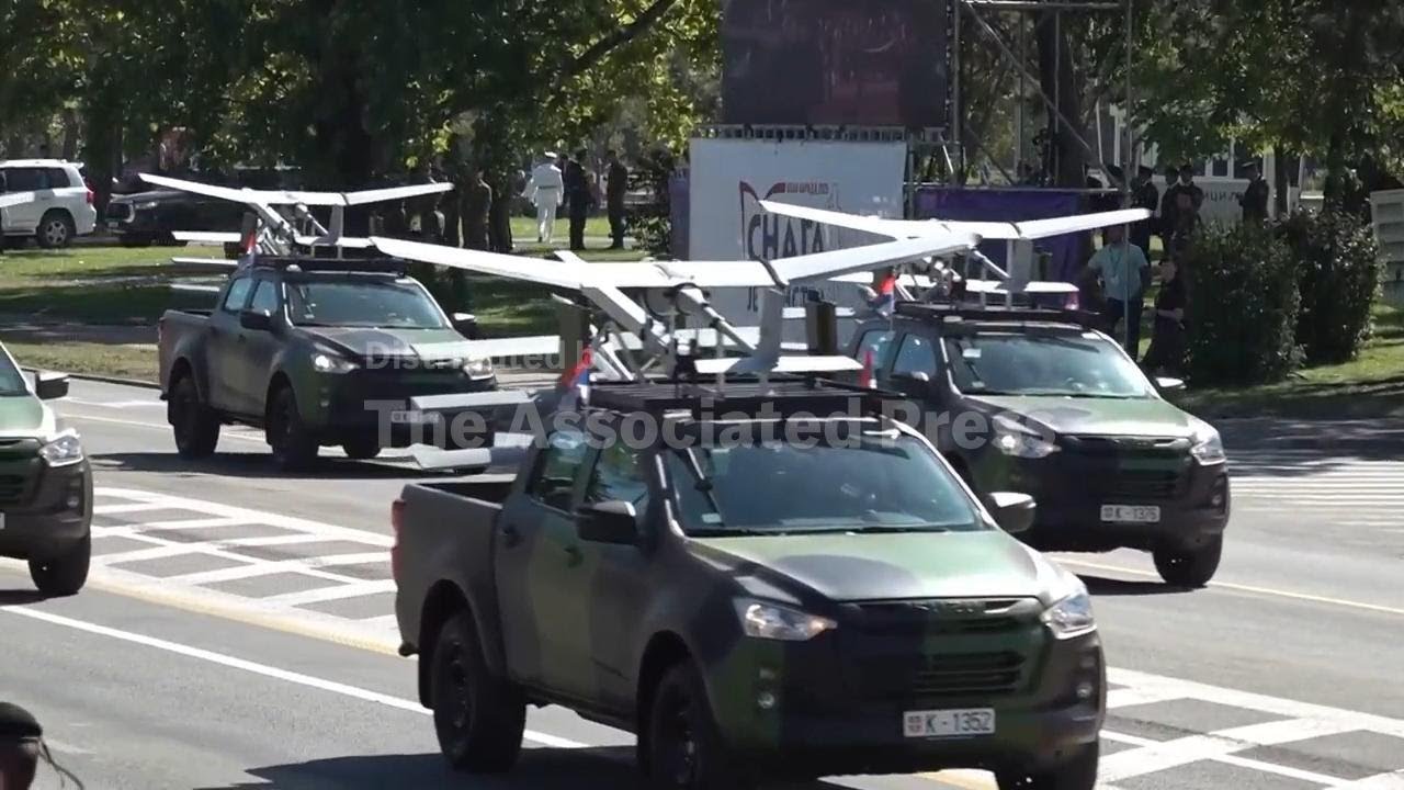 Serbia stages a large military parade to showcase tanks, jets and missile systems