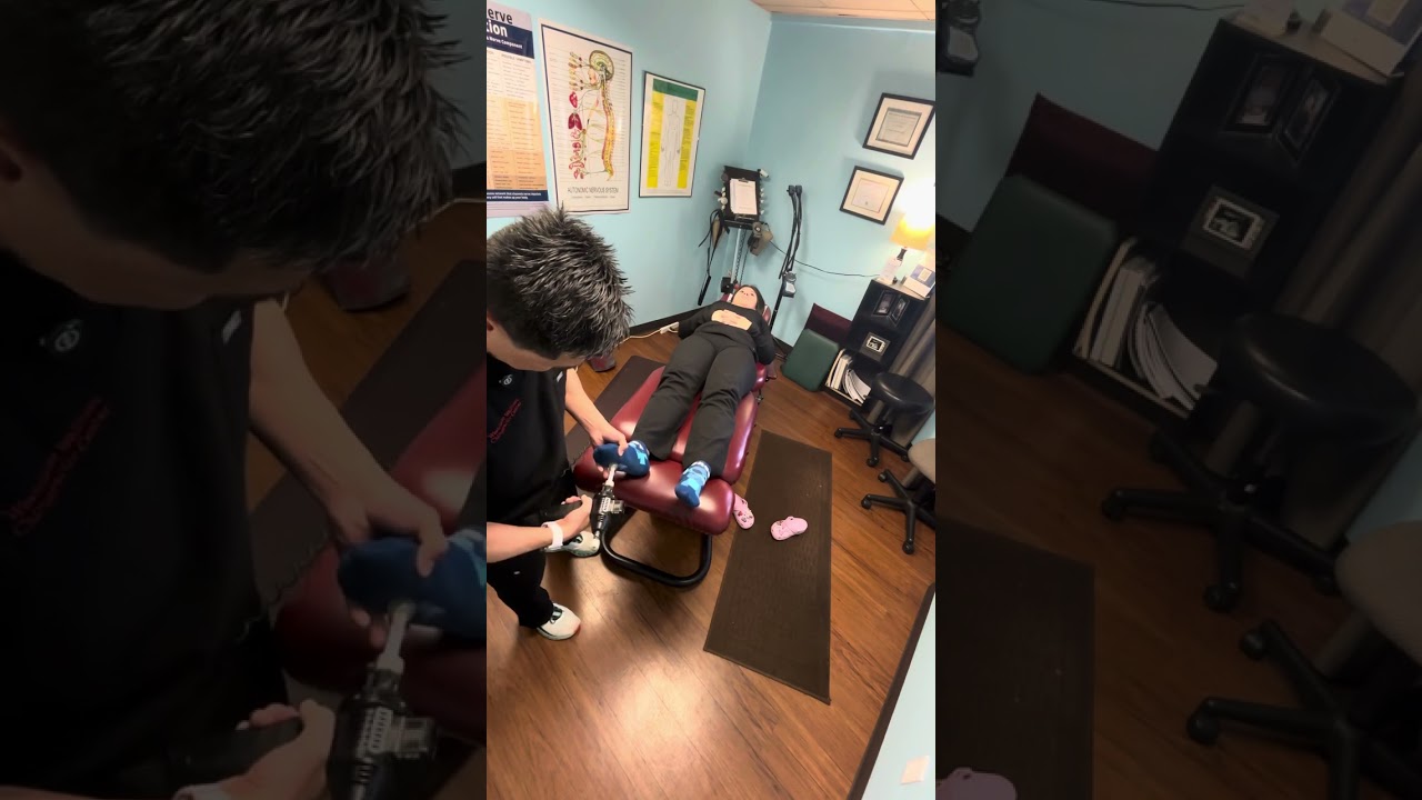 Adjusting a Foot with Arthrostim. Houston Chiropractor. Houston Asian Dinger. Dr John Huang.