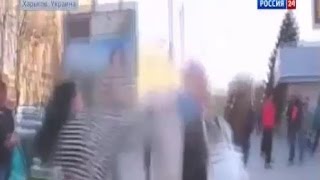 Пожилую женщину пытаются избить за критику майдана Пожилую женщину пытаются избить за критику майдана