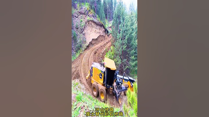 Road construction around the mountains, construction machinery, live shots, time to show real te