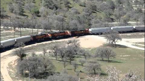 BNSF grain train with midtrain and rear DPUs at Tehachapi Loop 3-27-13