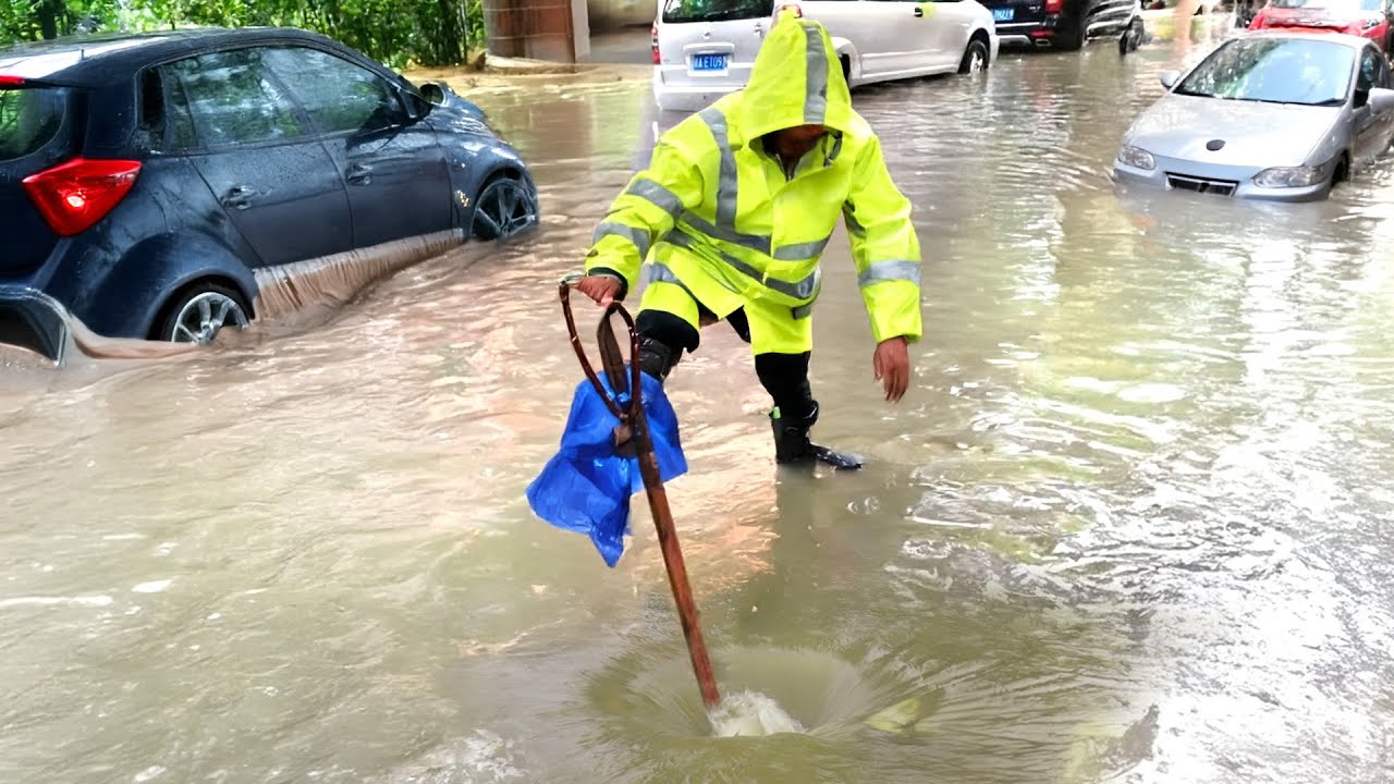 Unclogging a Massive Street Blockage Clearing Drains After Flooding ...