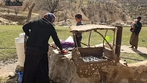 Iranian nomadic life: preparing lunch in a special hand made grill