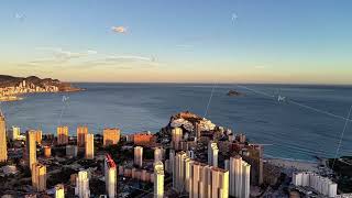 Coastal Skyline With Shimmering Water, Vibrant Harbor Scene With Highrise Structures And Ocean