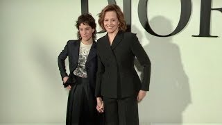 Sigourney Weaver and her daughter pose for the photographers at the Dior Fashion show