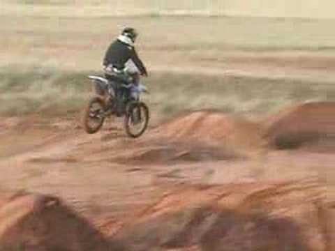 Derek Ledbetter and Craig Thomas riding motorcycle...