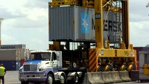 Straddle Carrier Loads Container Onto Truck, Ports of Auckland, 25 Oct 2010
