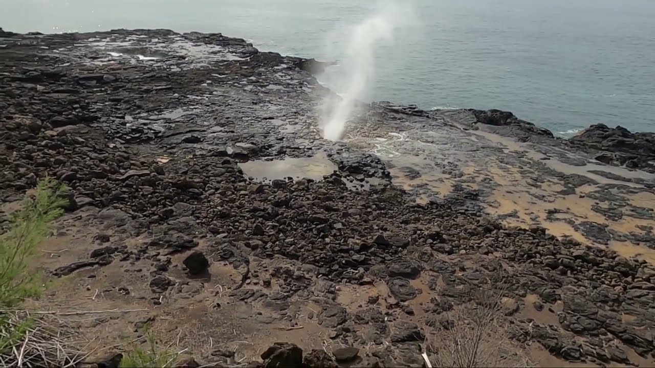 Spouting horn, Blow Hole near Poipu Beach Kauai Hawaii.