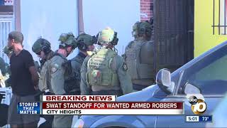 SWAT standoff for wanted armed robbers