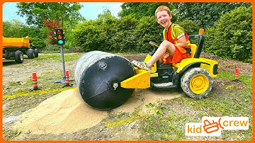 Fixing pothole in road with kids steamroller, dump truck, and trailer. Educational | Kid Crew