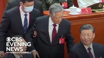 Former Chinese President Hu Jintao unexpectedly led out of Communist party congress