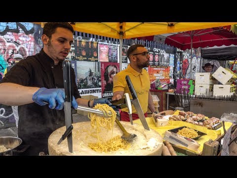 Italian Soft Fresh Spaghetti Savoured in a Cheese Wheel. London Street Food