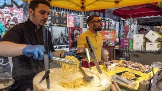 Italian Soft Fresh Spaghetti Savoured in a Cheese Wheel. London Street Food