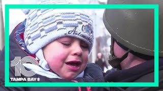 Baby cries uncontrollably as hes forced to say goodbye to his police officer dad in Ukraine